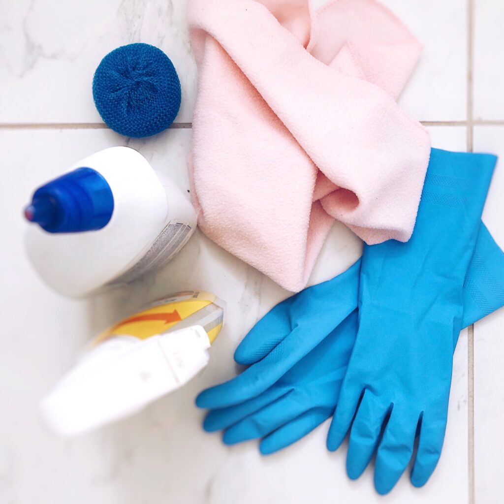 Overhead shot of cleaning products and supplies for household chores